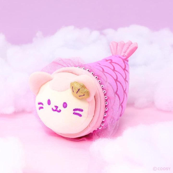 plush kitty wearing a pink and purple mermaid tale. 