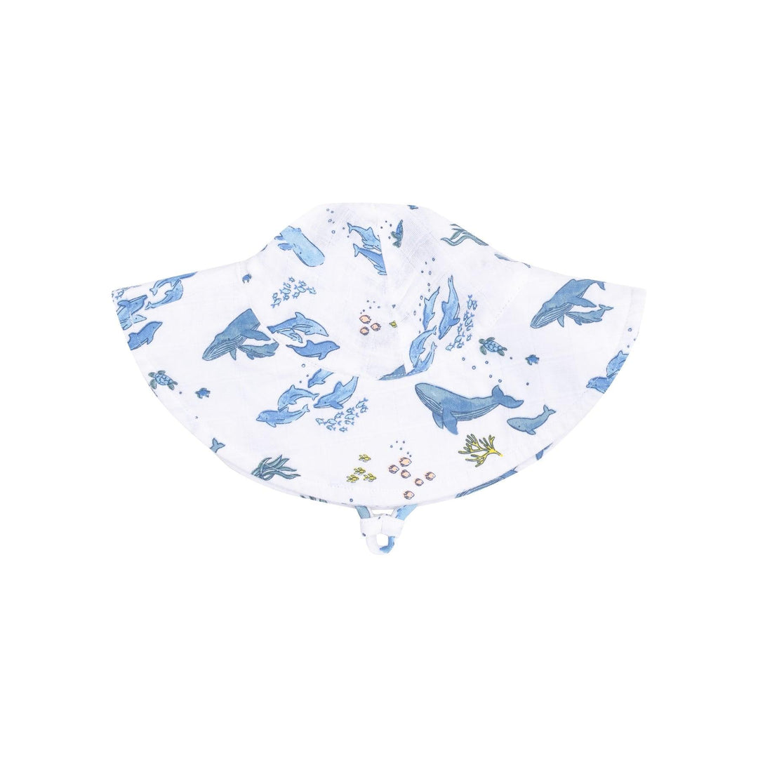 baby sunhat in white with blue watercolor whales all over. 