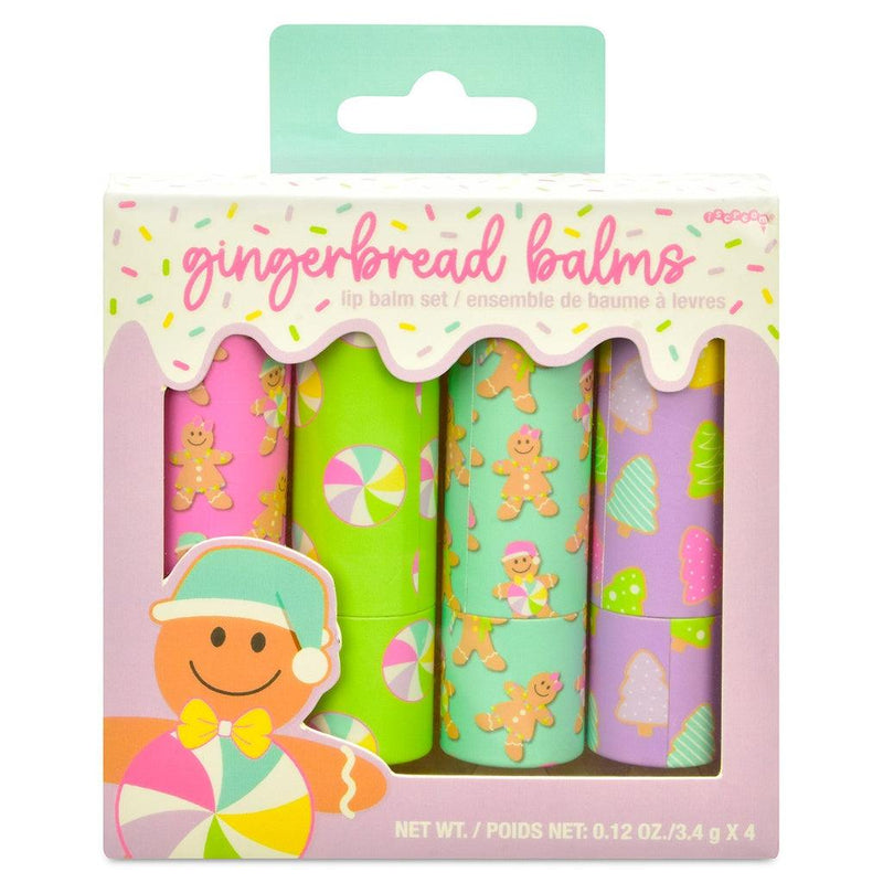 set of 4 lip balms with holiday designs on the outside. gingerbread boys and girls, peppermints and trees all adorn the outside of the lip balm