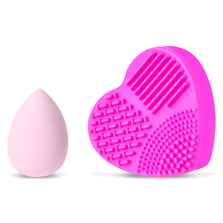 Pink silicone makeup brush cleaner and pink silicone scrubber on a white background
