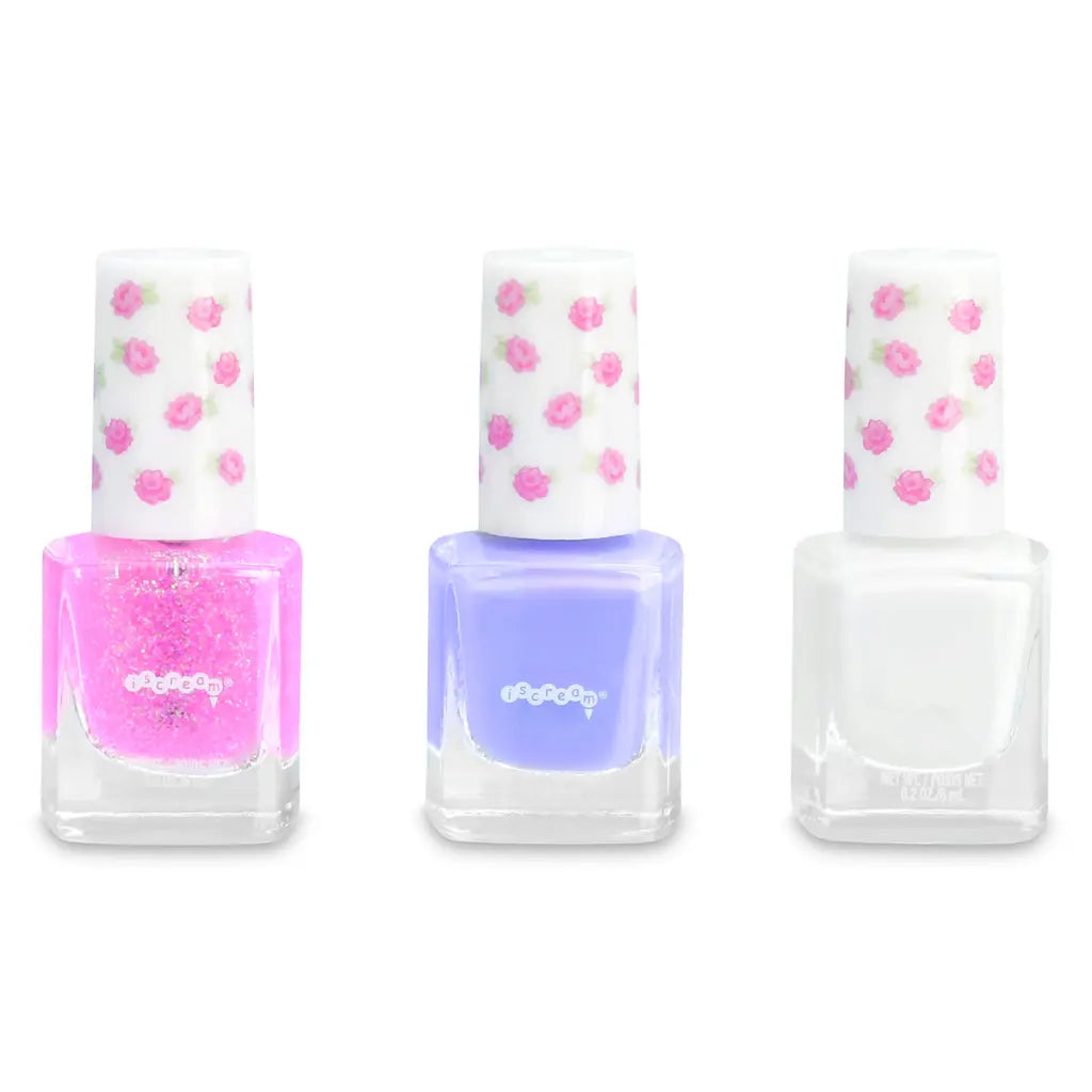 Three nail polish bottles: pink glitter, purple, white colors