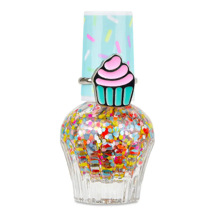 Nail polish bottle with cupcake design and colorful glitter on a white background
