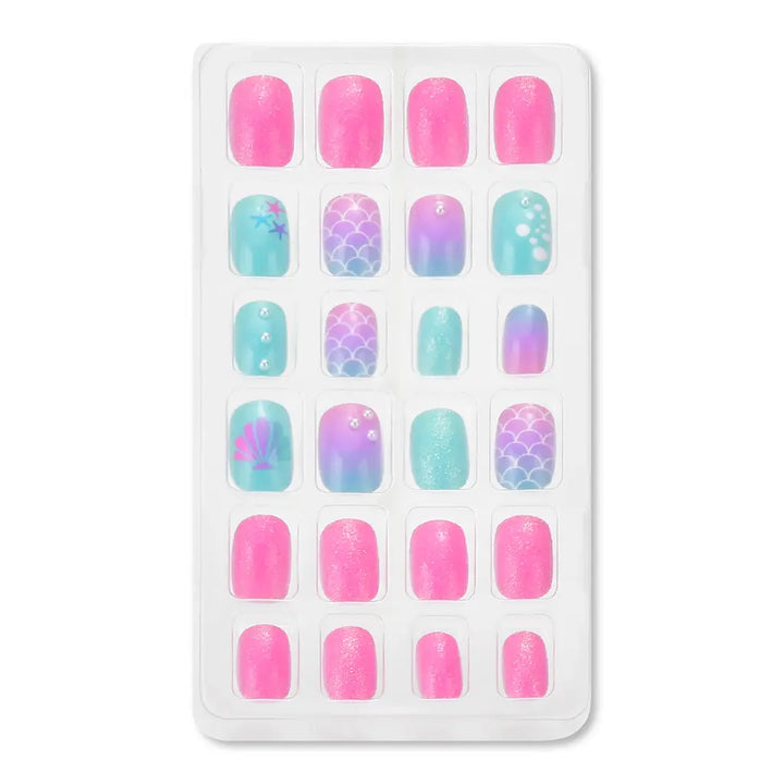 Set of colorful nail art designs on a white tray with a white background