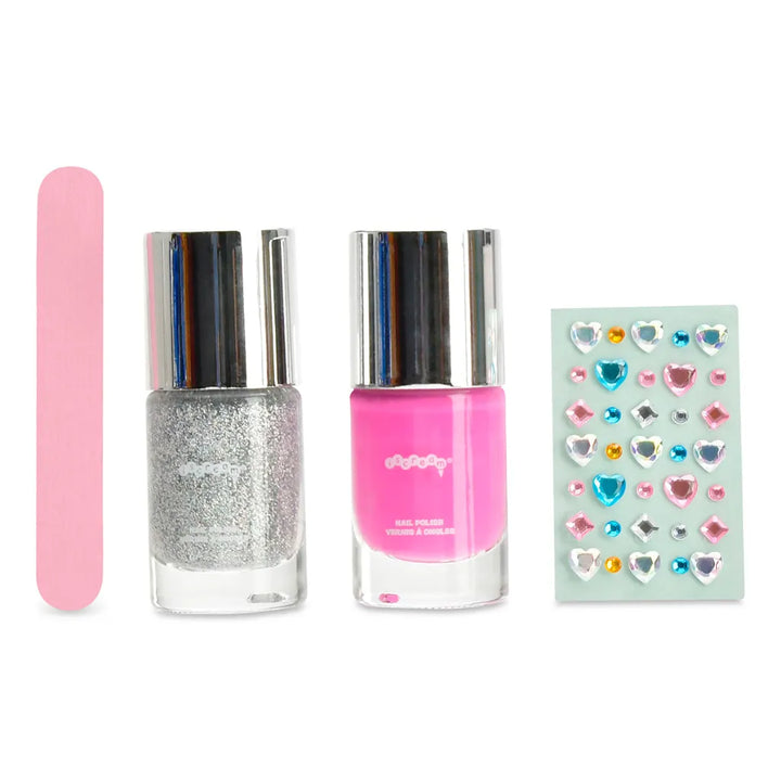 A nail kit set containing a pink nail file, a silver glitter nail polish bottle, a hot pink nail polish bottle, and a sheet of colorful heart-shaped rhinestone stickers, all arranged on a plain white background.