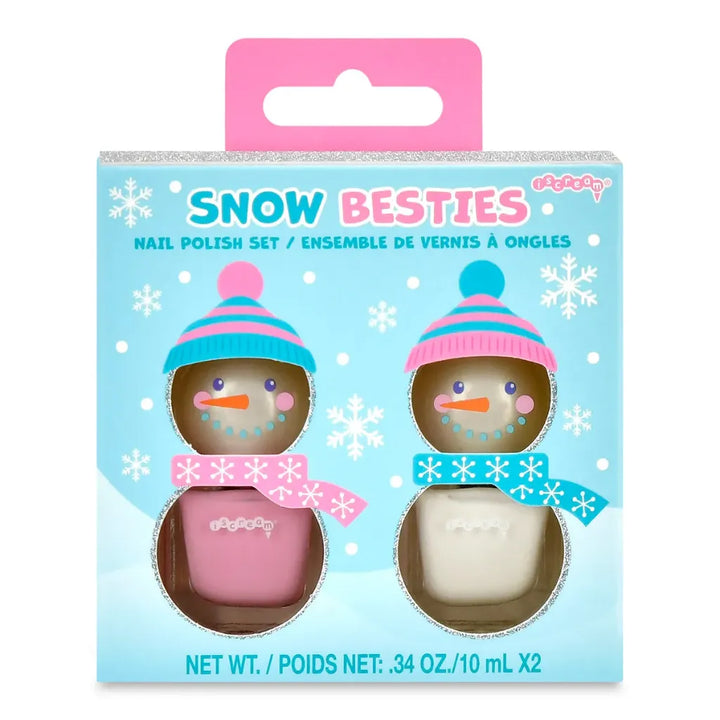 A retail package of a 'Snow Besties' nail polish set containing two small bottles shaped like snowmen, one with pink polish and one with white polish, set against a light blue background with snowflake designs.