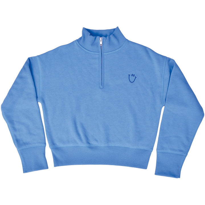 A light blue quarter-zip sweatshirt with a small dark blue embroidered smiley face logo on the left chest, displayed flat against a white background.