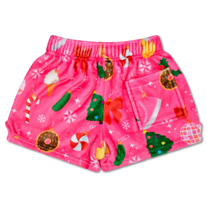 Pink shorts with festive pattern on a white background