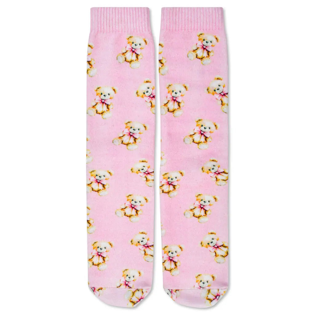 Pink socks with teddy bear pattern on a white background