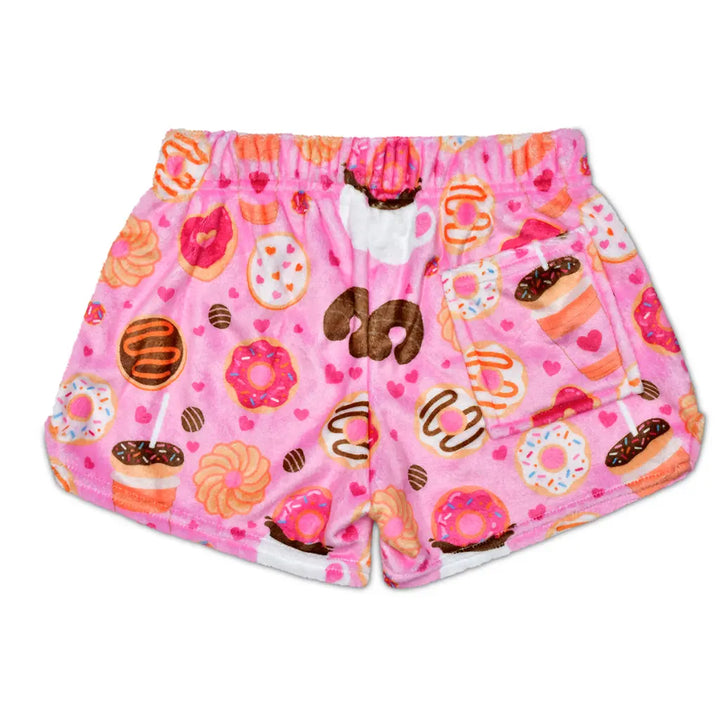 Pink shorts with donut pattern on a white background