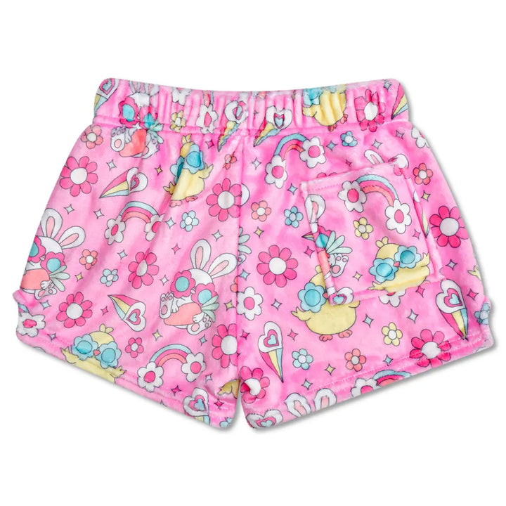Pink children's shorts with cartoon character and floral pattern on a white background