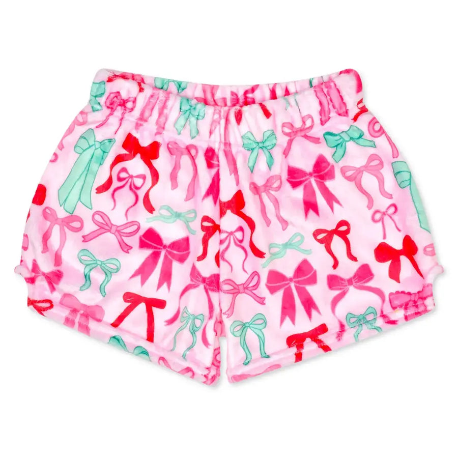 Pink shorts with an allover pattern of red and mint green bows, shown flat against a white background.