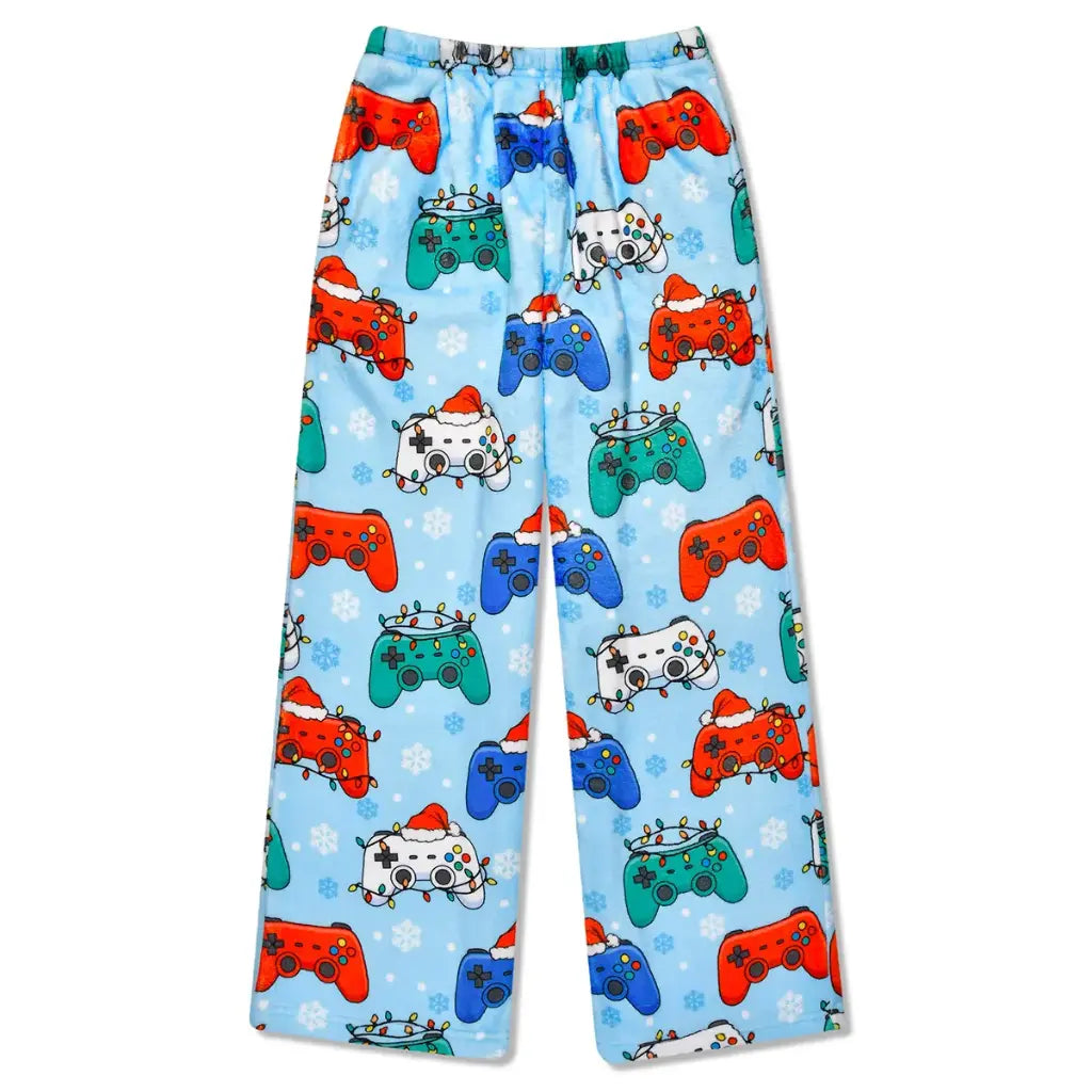 Light blue pajama pants with an all-over print of video game controllers decorated with Christmas hats and ornaments, accented with white snowflakes.