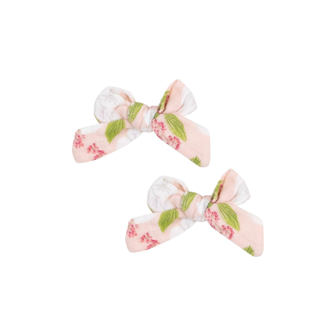set of bow clips in the magnolia printed fabric. 