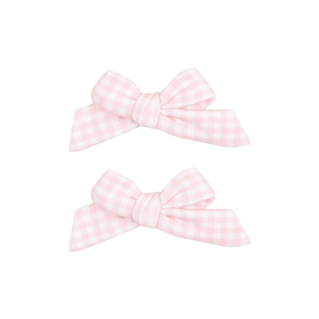 set of hair bow fastened to an alligator clip in pink and white gingham fabric. 