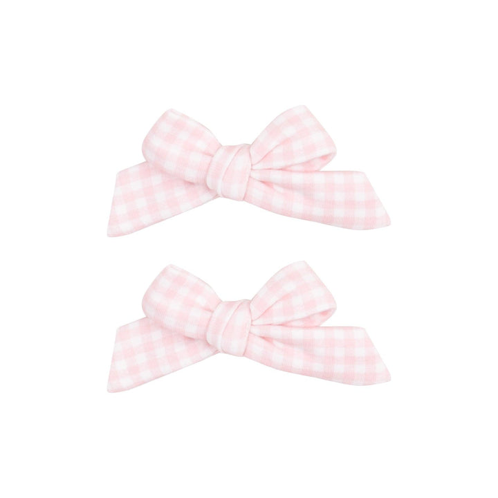 set of hair bow fastened to an alligator clip in pink and white gingham fabric. 