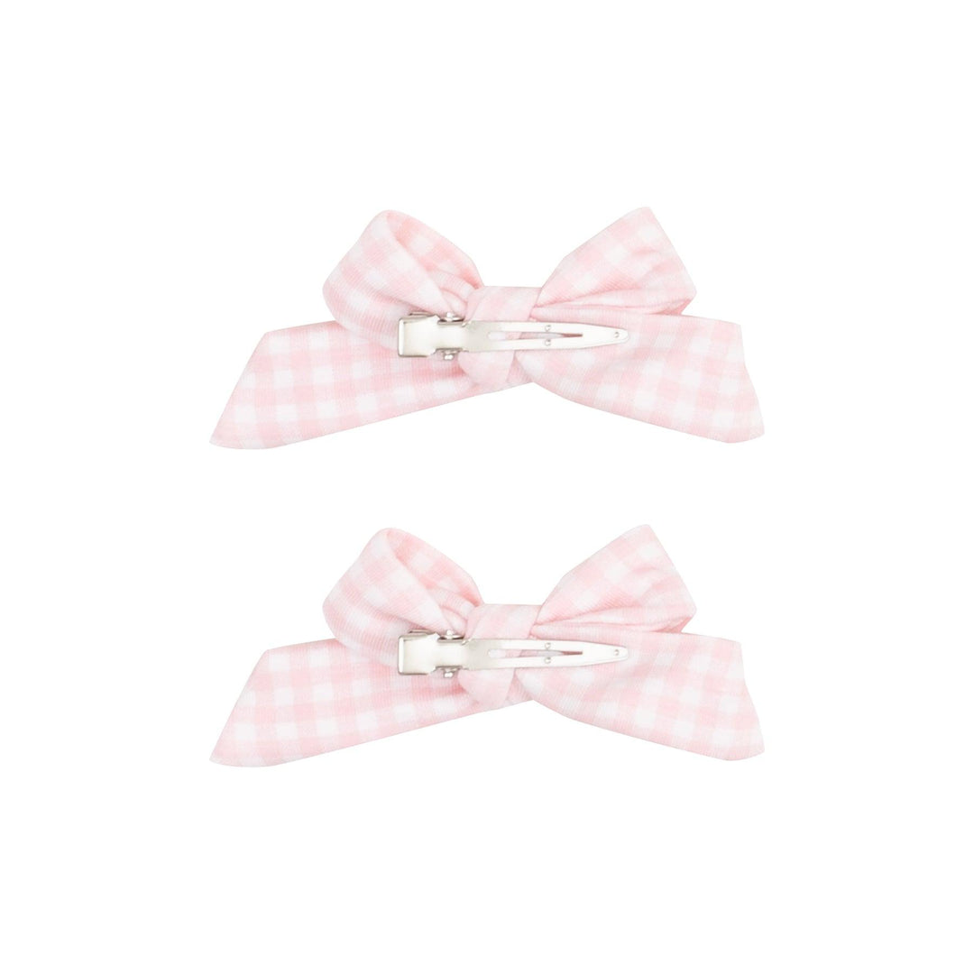 the bows are fastened to an alligator clip in pink and white gingham. 