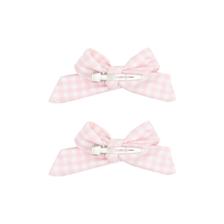 the bows are fastened to an alligator clip in pink and white gingham. 