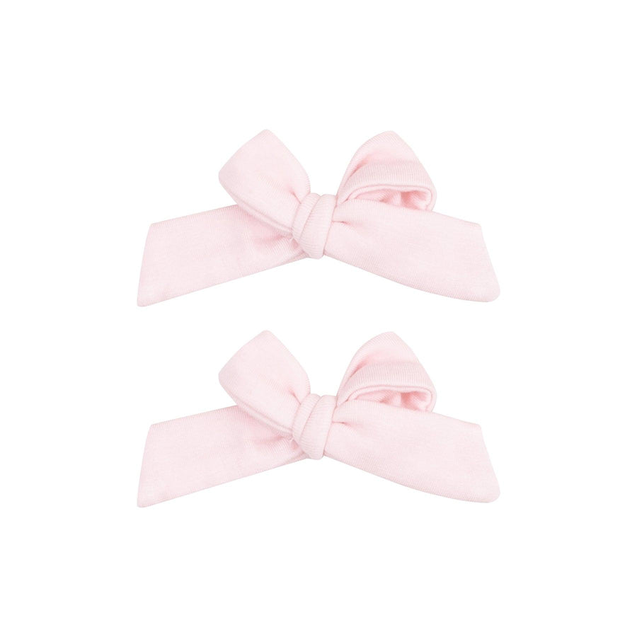 set of baby girl clips in ballerina pink fastened to alligator clips. 