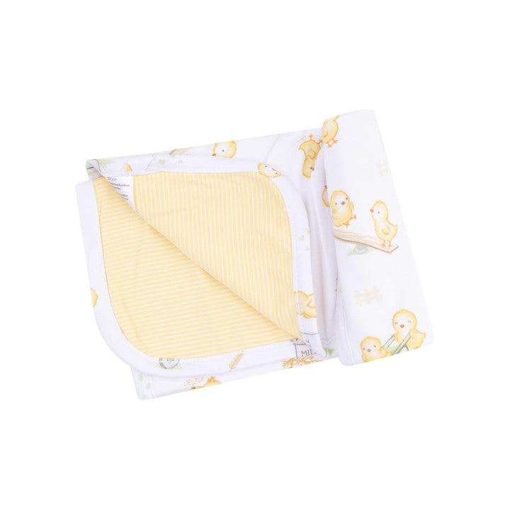 baby blanket made of bamboo with yellow stripes on one side and baby yellow chicks on the other side. 