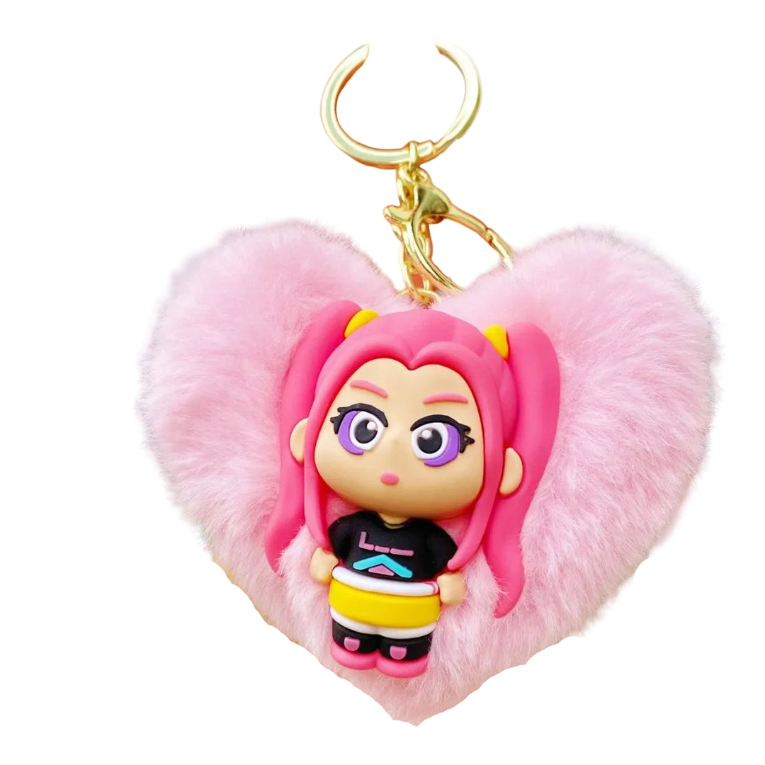 Keychain with a character design featuring pink hair and a fluffy heart-shaped attachment, held in a hand.