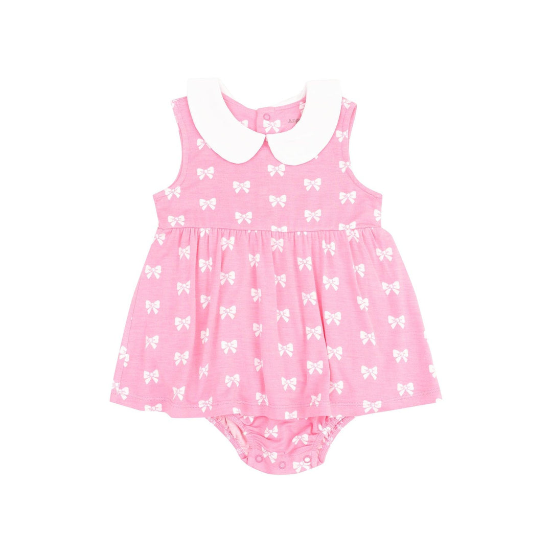 pink bubble with dress attached and a white peter pan collar with white bows all over it. snaps at the bottom for easy changing. 