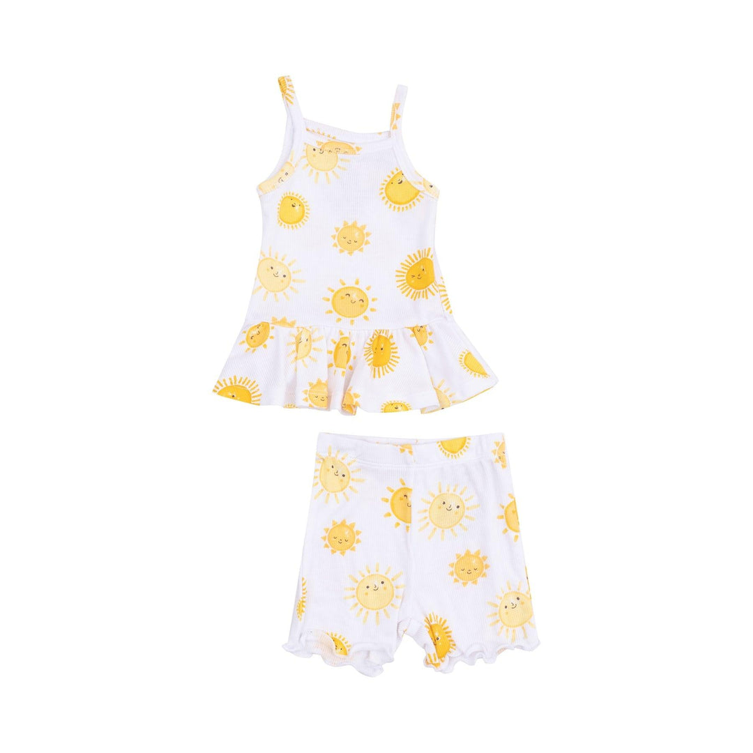 white peplum tank and matching bike shorts with happy yellow suns printed all over it 