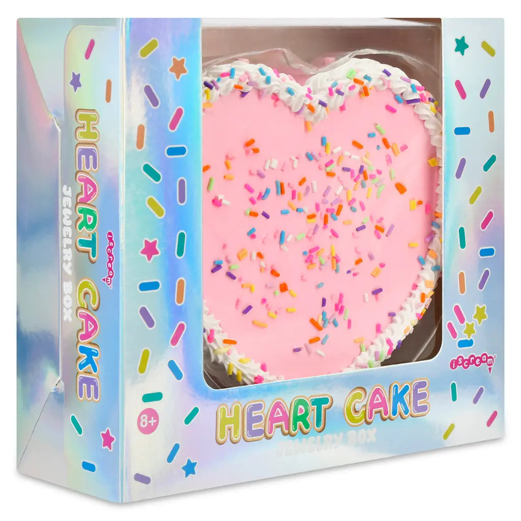 Heart-shaped cake with sprinkles in a colorful box packaging.