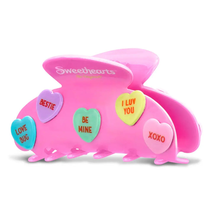 Pink hair clip with heart-shaped conversation cards on a white background