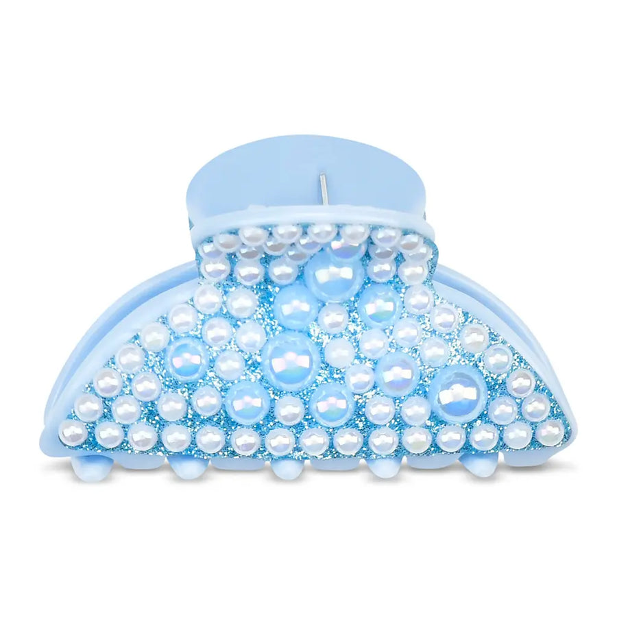 Blue claw clip with pearl-like beads on a white background