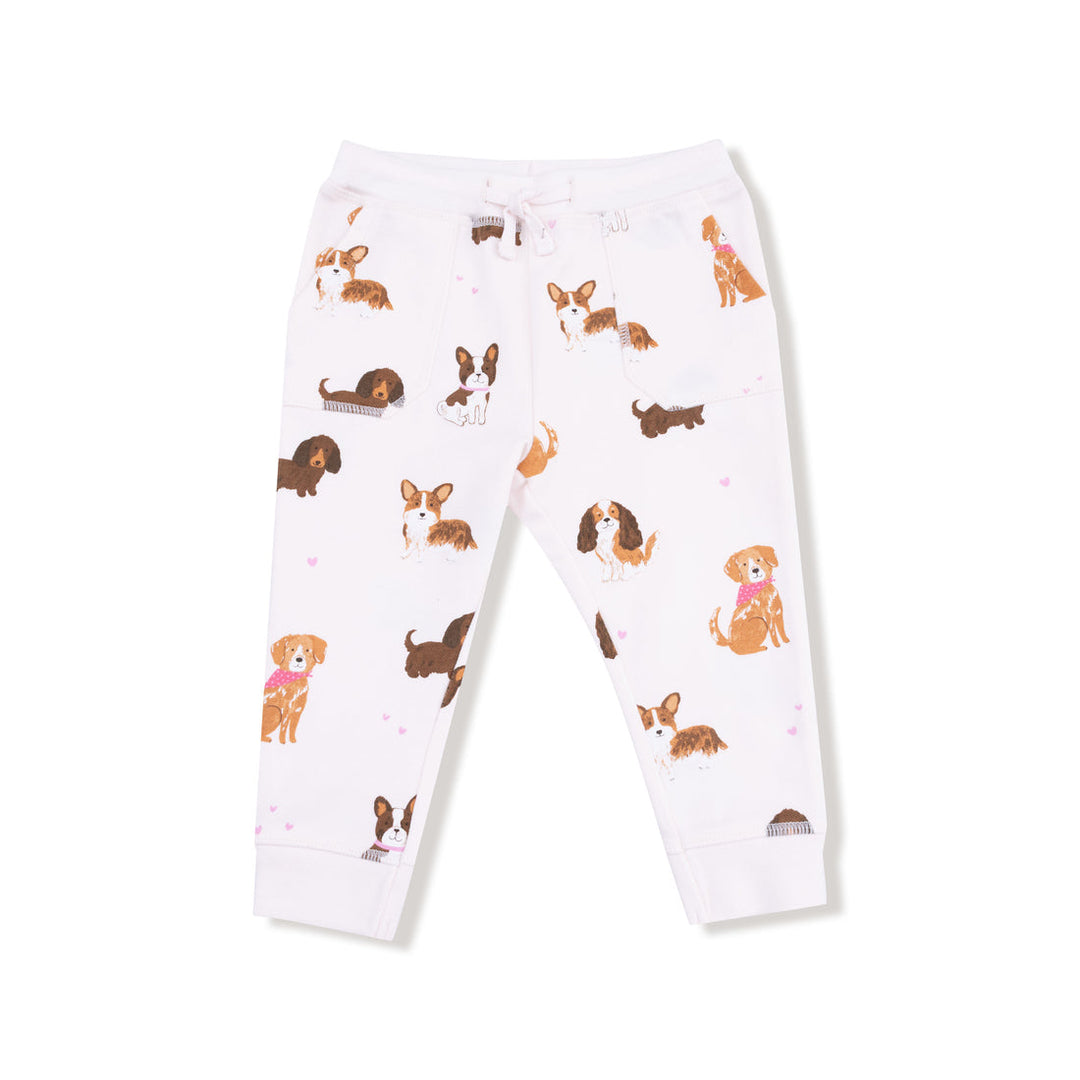 White jogger pants with dog pattern on a white background
