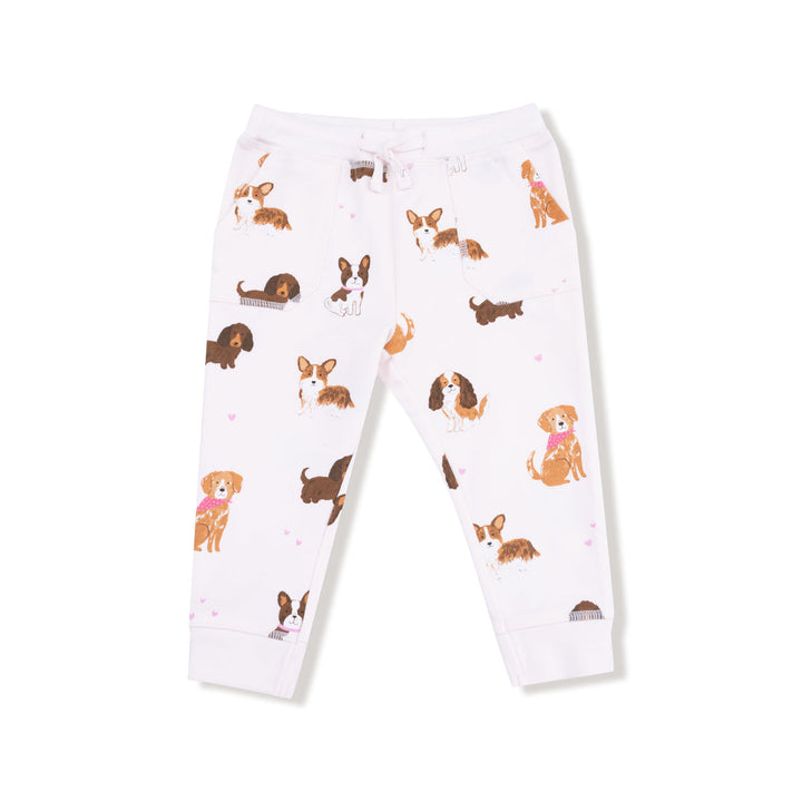 White jogger pants with dog pattern on a white background