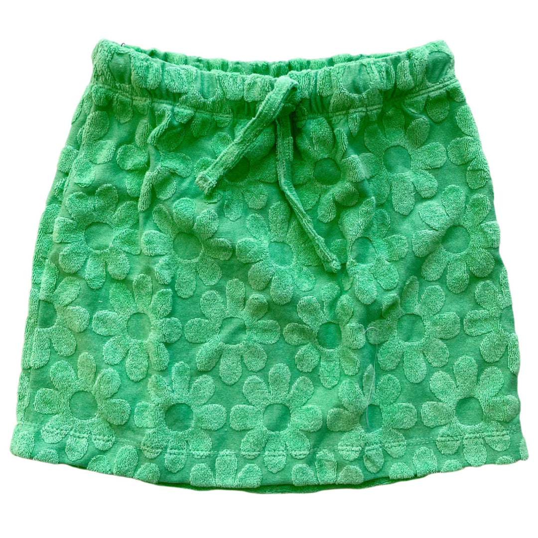 green terry skirt with flower imprints. drawstring at the waist. floral imprints on the skirt. straight style skirt