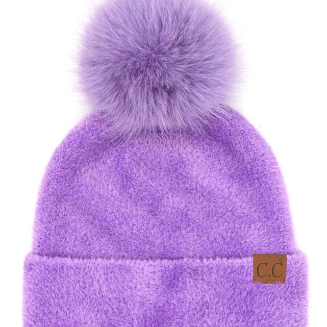 purple chenille furry hat with a pom pom on top of a beanie 