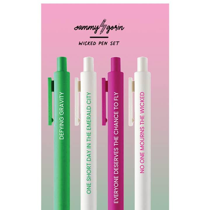 gel pen set in the theme of wicked the musical/movie. the pens are pink , white and green with different sayings on them: Defying Gravity, No one mourns the wicked, everyone deserves the chance to fly, one short day in the emerald city. 