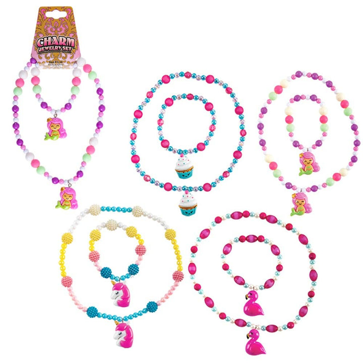 Set of colorful beaded jewelry with charms on a white background