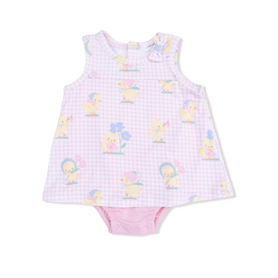 Baby dress with duck pattern on a white background