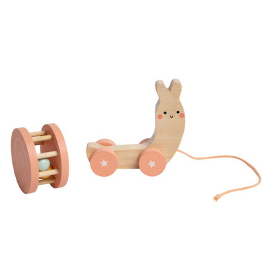 wooden pull toy that has a detachable back that acts like a rattle . looks like a snail