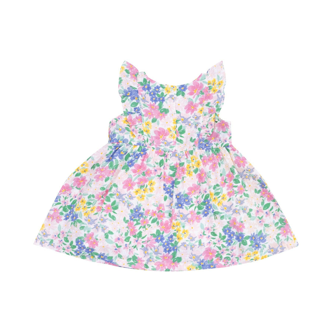 back of the astel floral dress with three buttons at the top half of the dress. 