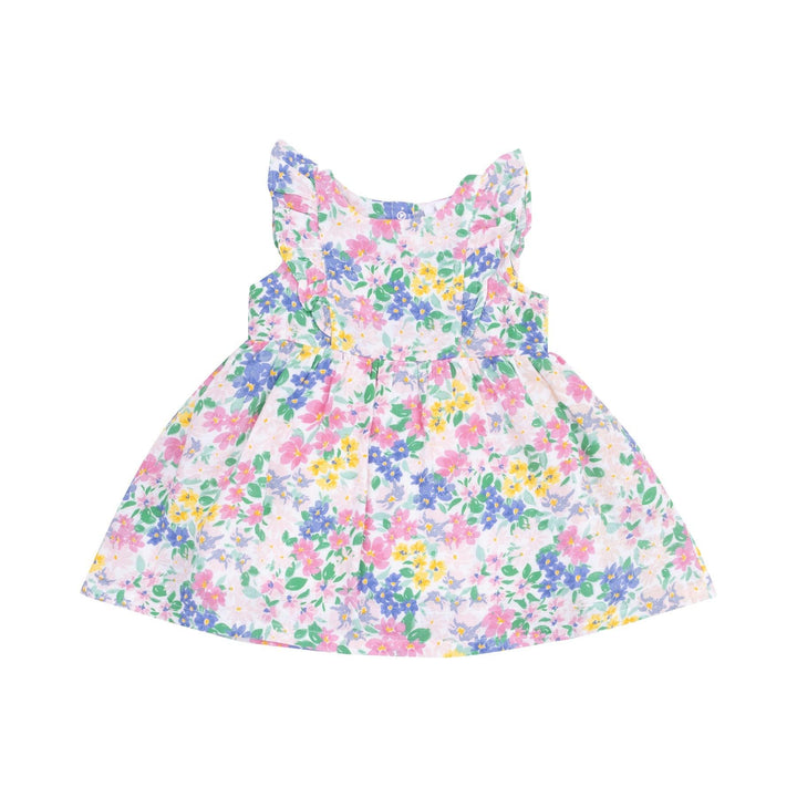 girls dress with ruffles at the top the of the dress and an empire waist. pastel floral dress. 