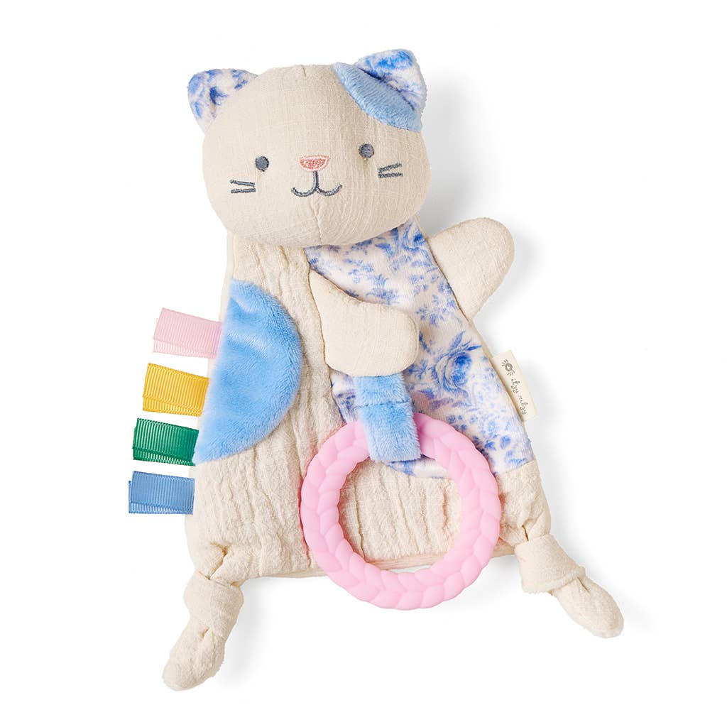 Cat-shaped plush toy with colorful rattle on a white background