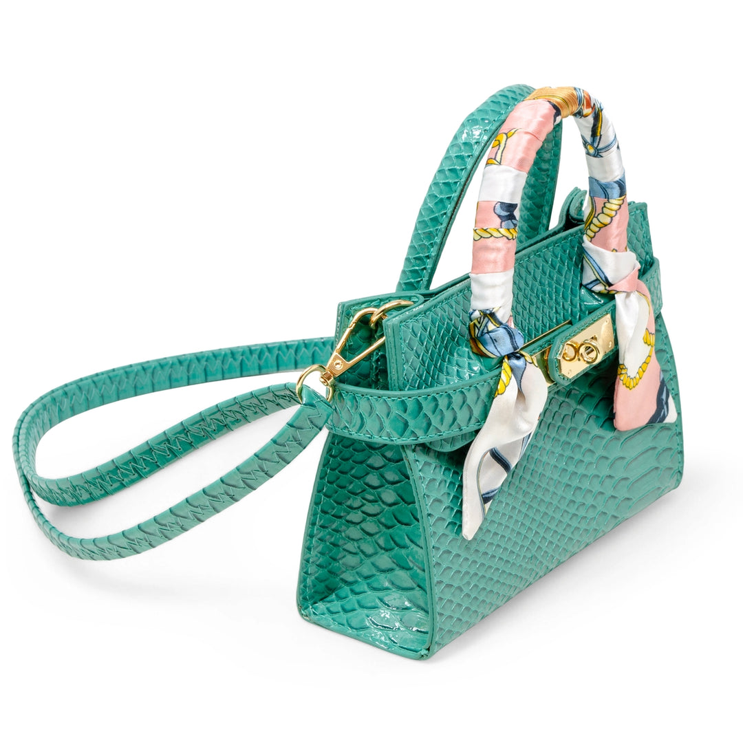 Green handbag with a matching scarf on a white background