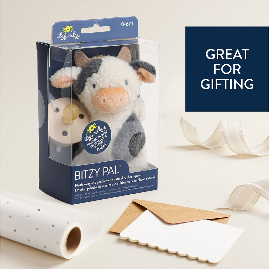 plush cow toy with an attachment for a pacifier 