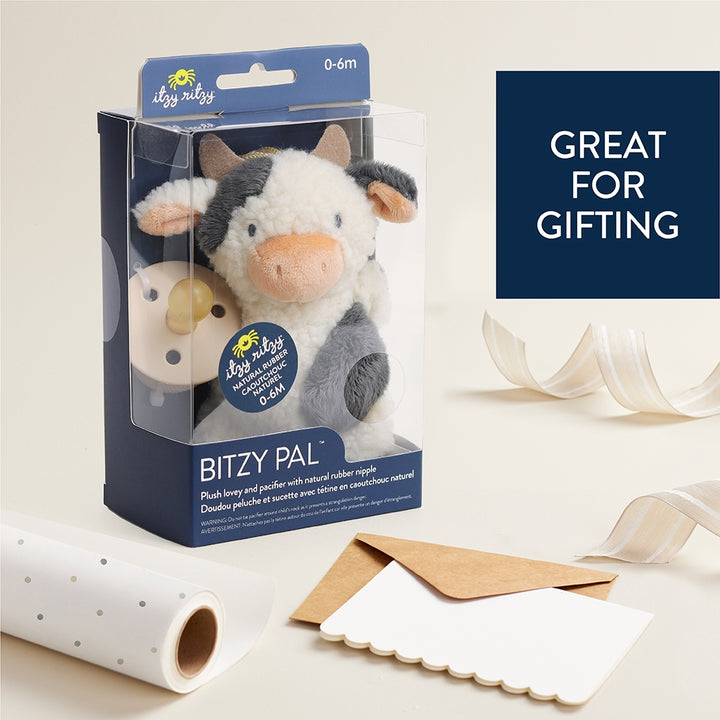 plush cow toy with an attachment for a pacifier 