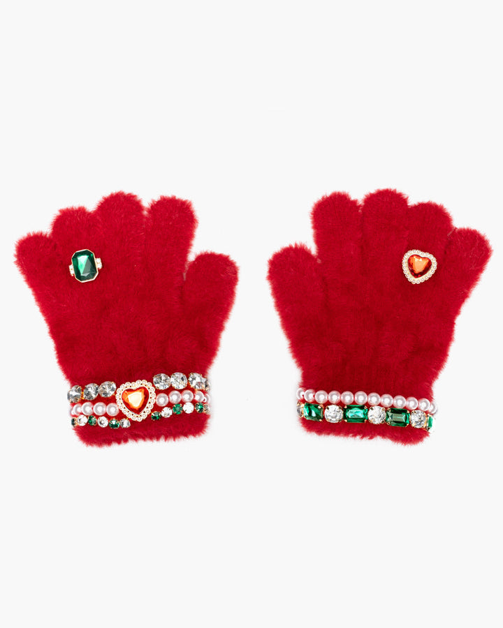 Red gloves with decorative heart and gem designs on a white background