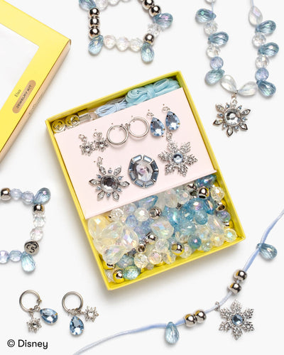 jewelry making kit with Elsa from Frozen theme. featuring light blue beads, clear beads, rhinestones and snowflake charms