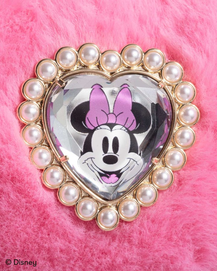Heart-shaped brooch with Minnie Mouse design on a pink background