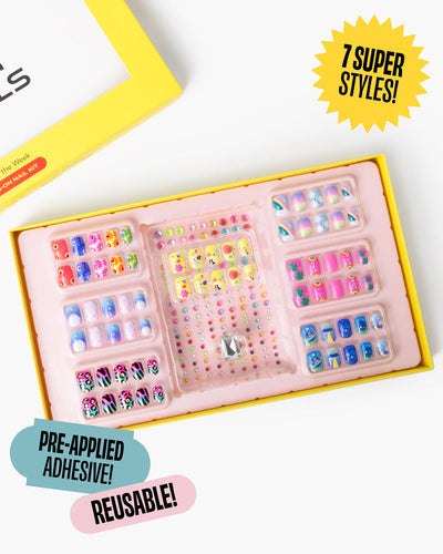 press on nail kit with lots of designs on the nails including tiny gems 