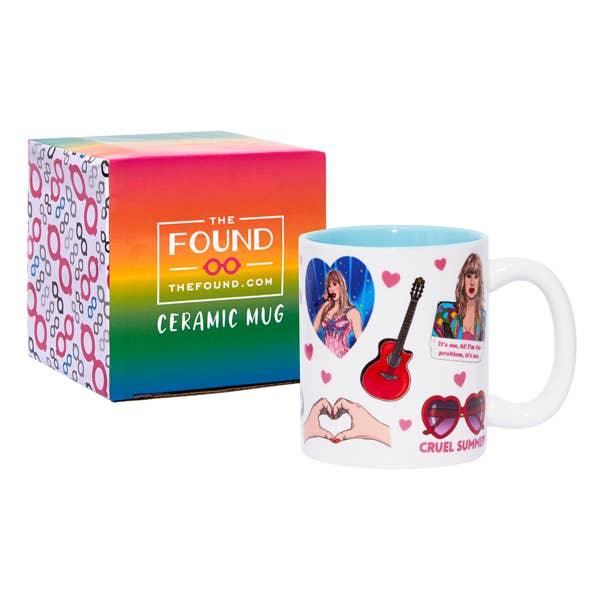 Taylor swift collage photos on a ceramic mug and the colorful packaging it comes in. 