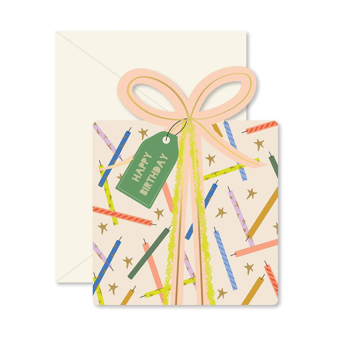 Birthday card with a decorative bow and candles pattern on a white background