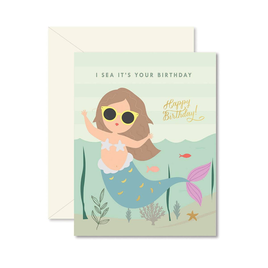 greeting card with mermaid on the front and a mermaid. The card says "I Sea it's your Birthday". 